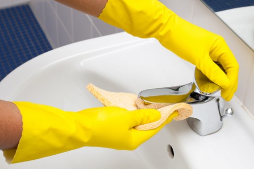 Trained carpet cleaner using protective equipment during service
